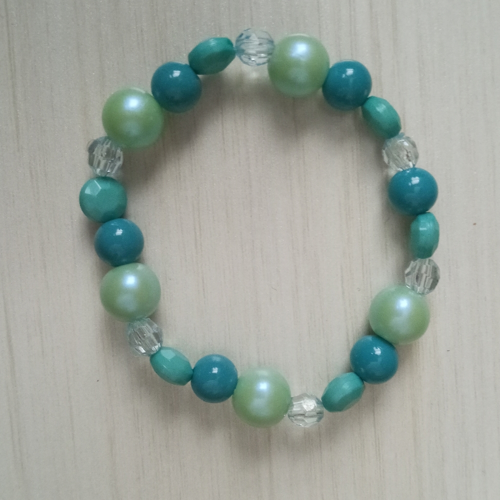 Hand crafted aqua beaded stretchy statement bracelet blue and coastal